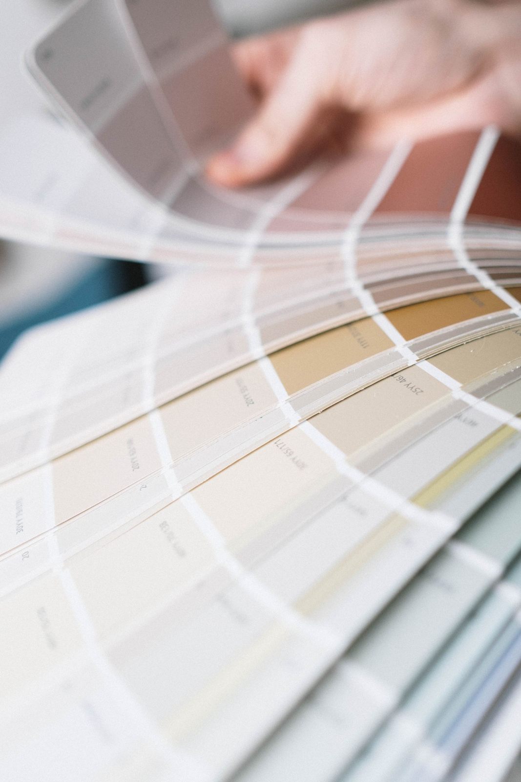 Detailed close-up of a multi-colored color swatch palette being fanned out for interior design selection